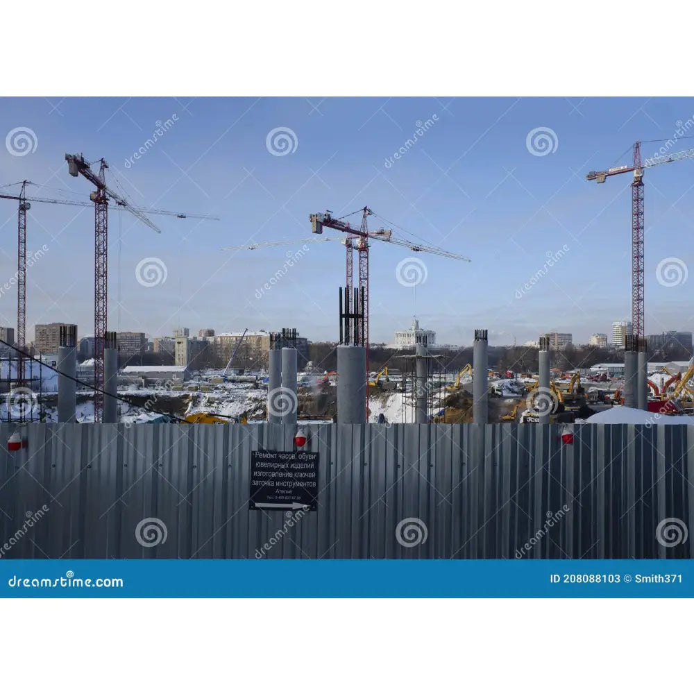 Gray metal construction crane towers under clear blue sky with hjc hj-20m klart visir for is-17 fg-st helmets