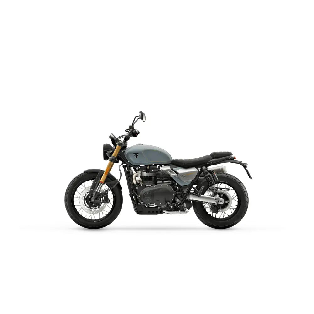 Gray triumph scrambler 900 2026 with black seat gold front fork featuring metzeler tourance and 270-graders tenning
