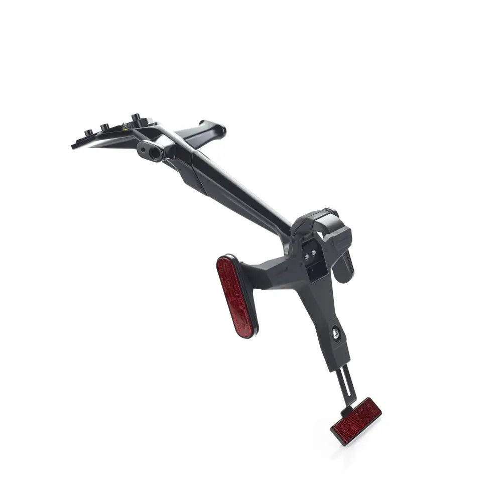 Black triumph tail tidy rear rack with integrated red reflectors for street triple 765 shown from back side