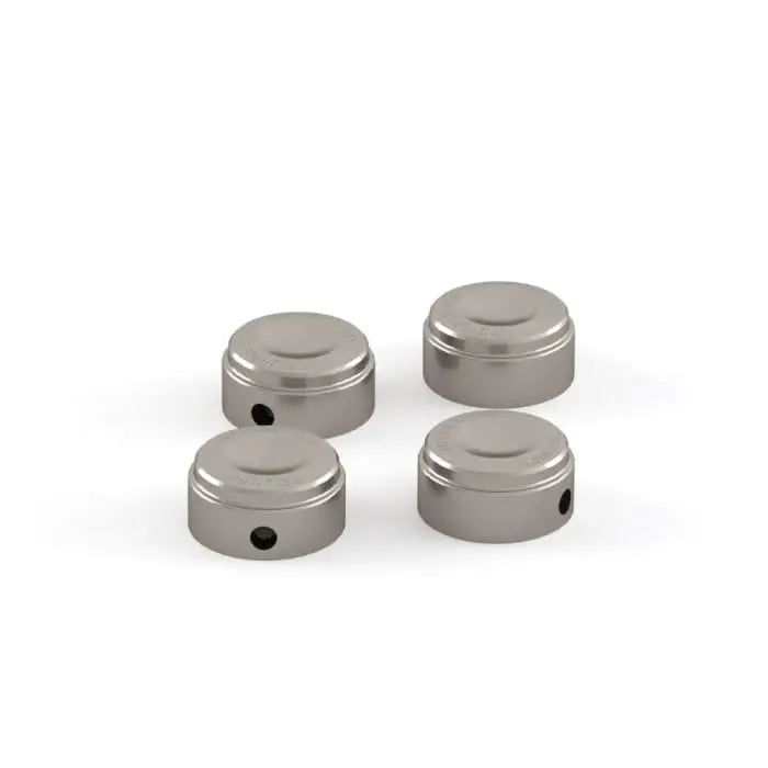 Set of four brushed stainless steel cylindrical triumph toppboltdeksler with central hole for atv-er og utv-er tilhenger