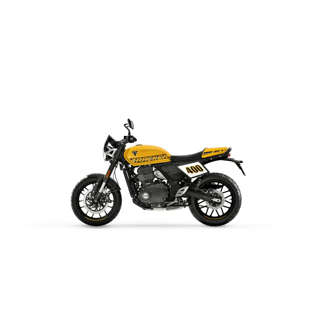 Yellow and black triumph tracker 400 modern classic motorcycle with racing design and pirelli mt60 tires 2026 model