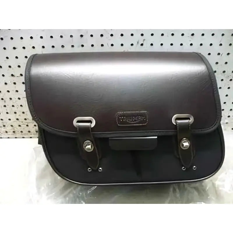 Black leather motorcycle saddlebag with silver metal hardware and embossed plaque for triumph waxed cotton bonneville t120